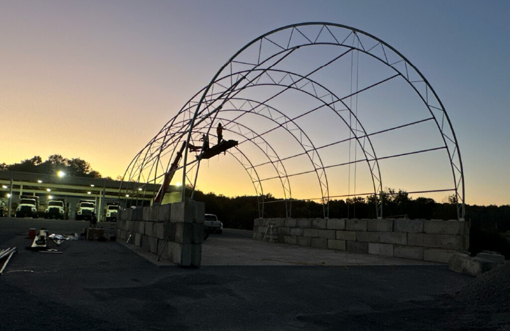Install crew erecting the Accu-Steel Advantage steel truss structure.